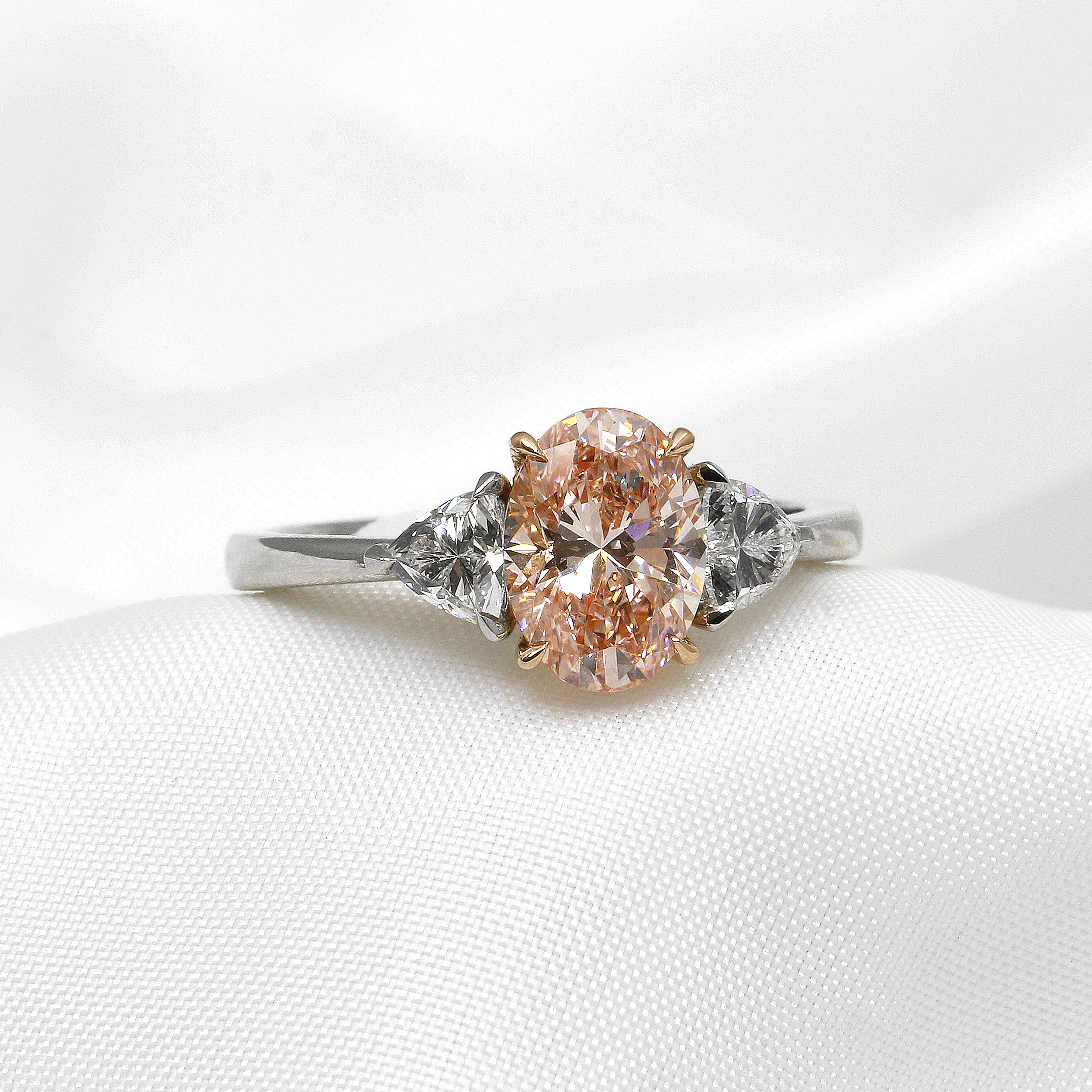 Laboratory Created Pink Oval and Trilliant Cut Diamond Three Stone Ring