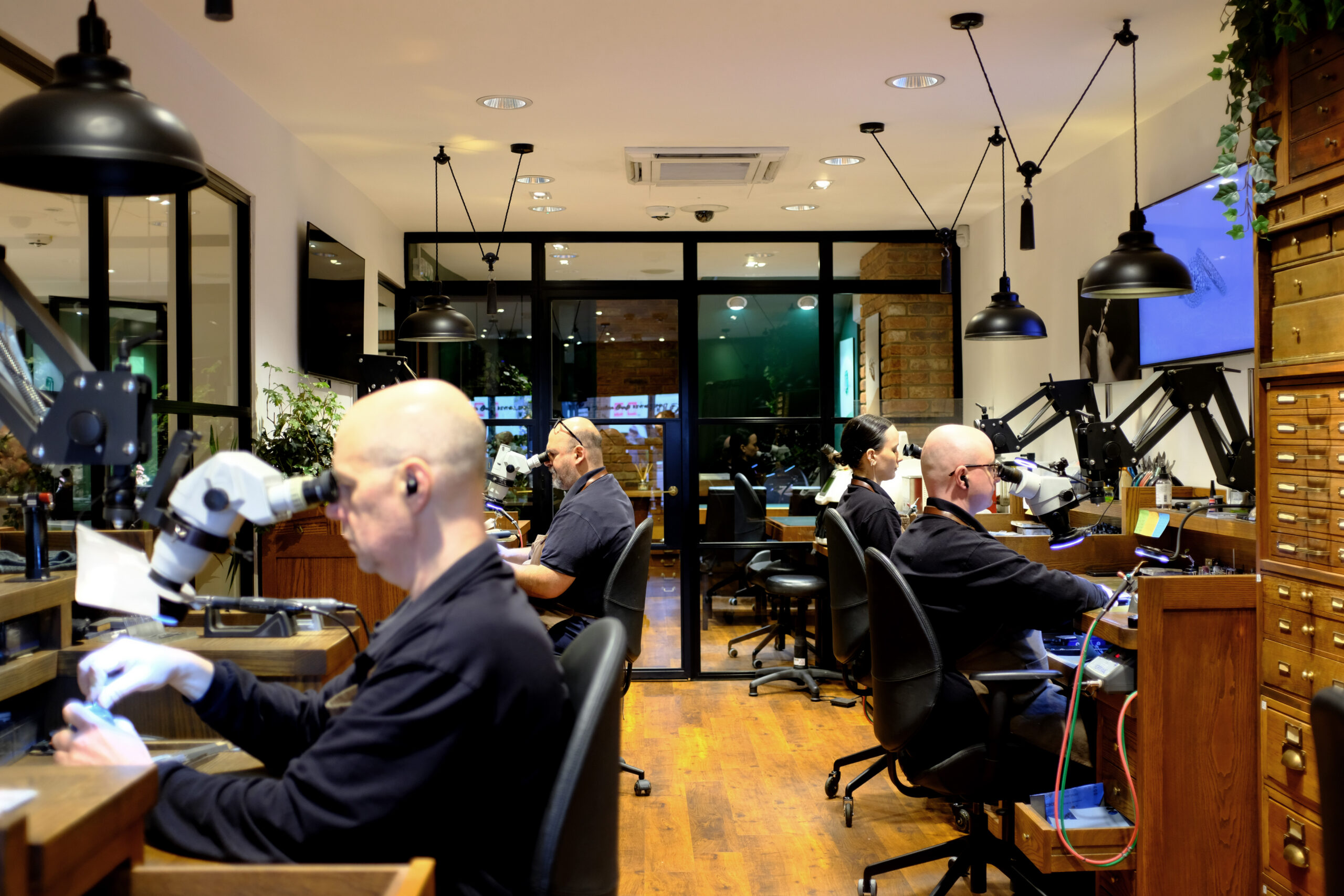 craftsmen working in jewellery workshop