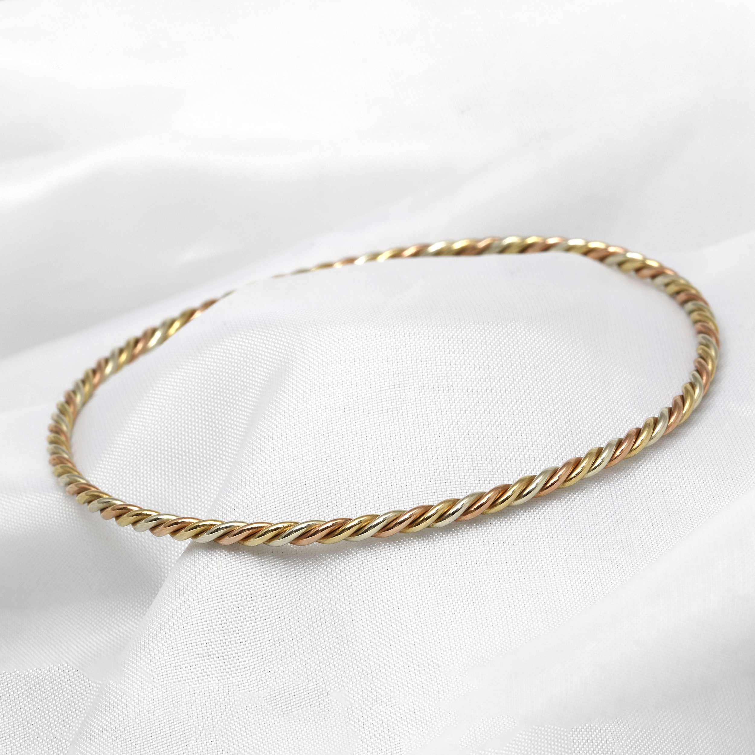 Three Colour Twisted Bangle in 9ct Gold
