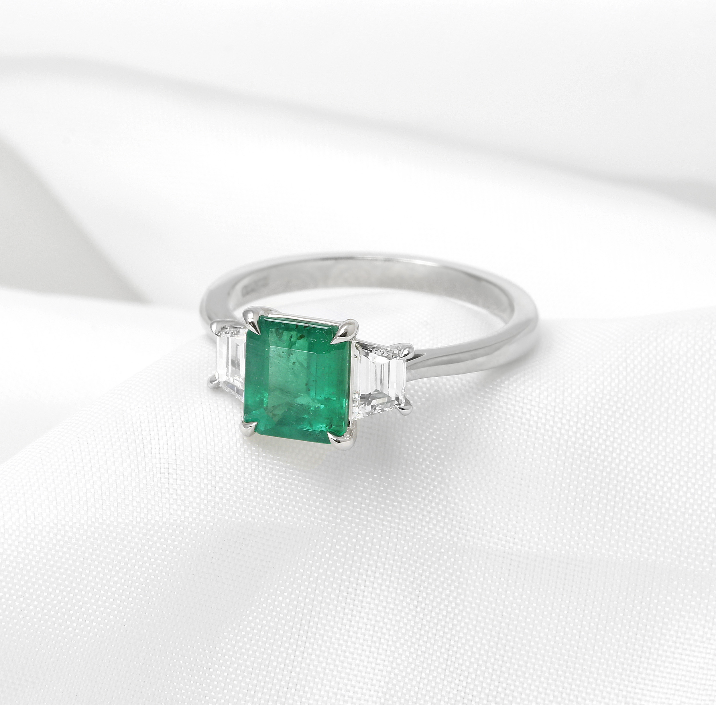 Emerald and Trapeze Cut Diamond Three Stone Ring