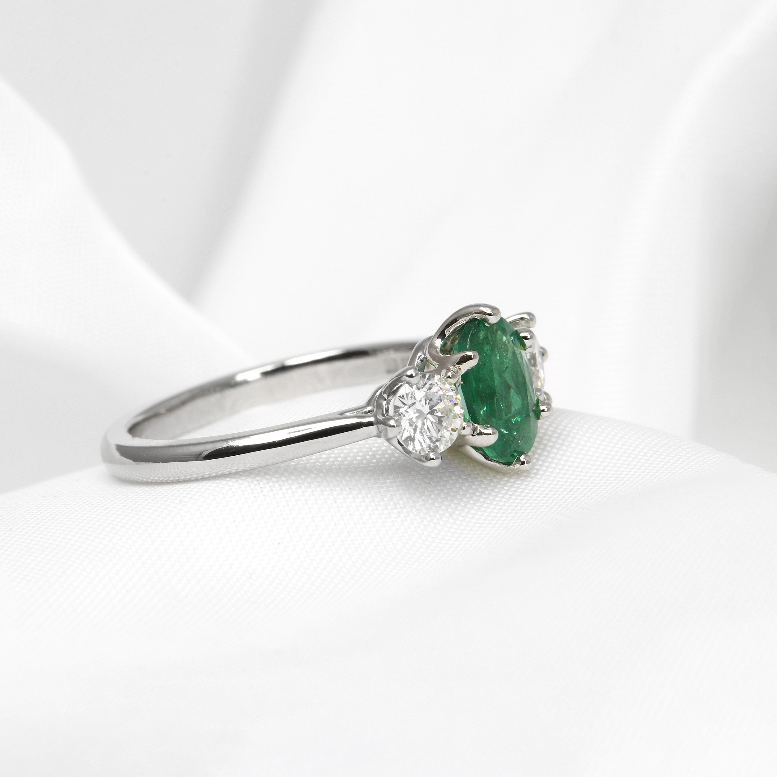 Emerald and Diamond Three Stone Ring in Platinum