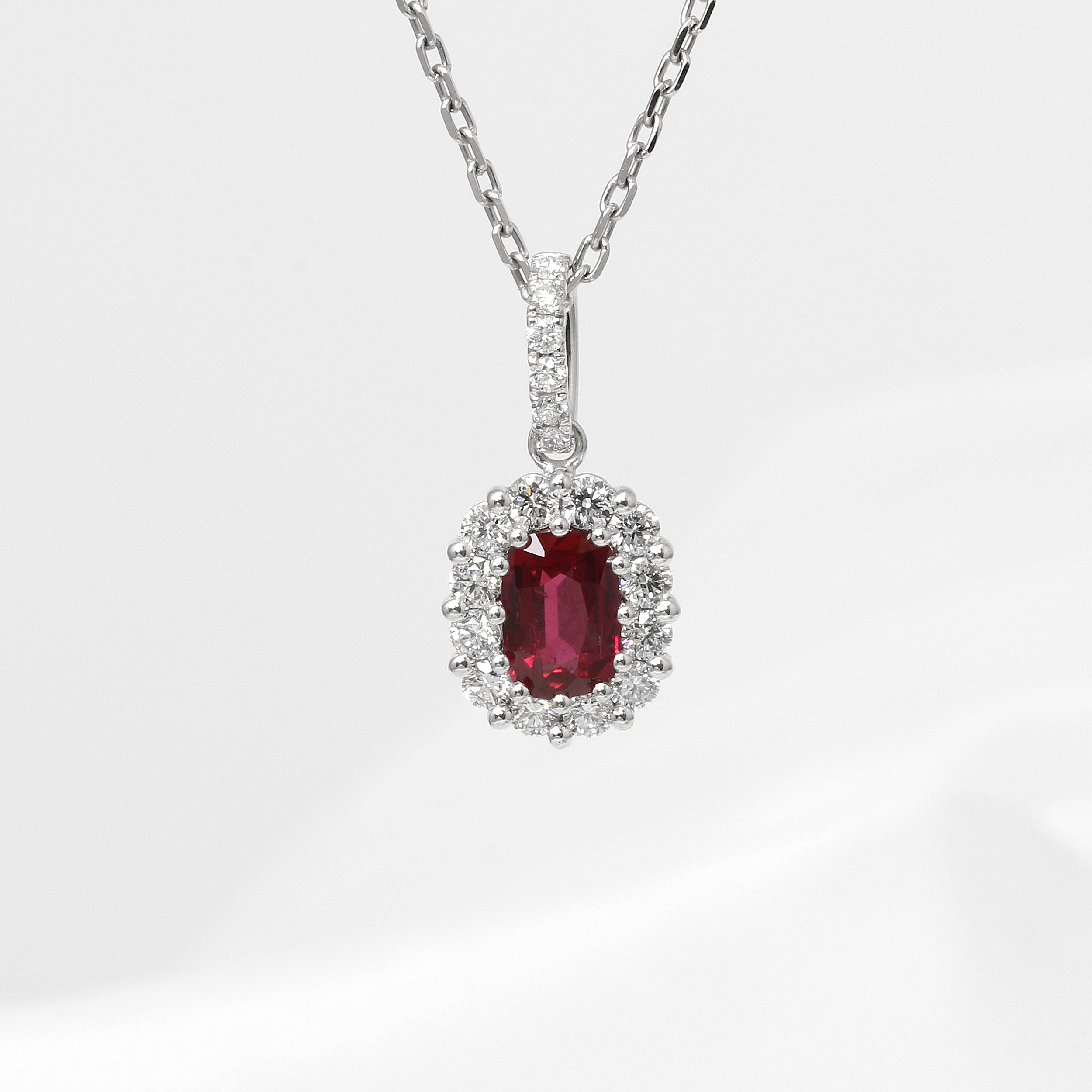Ruby and Diamond Halo Cluster Pendant in 18ct White Gold
