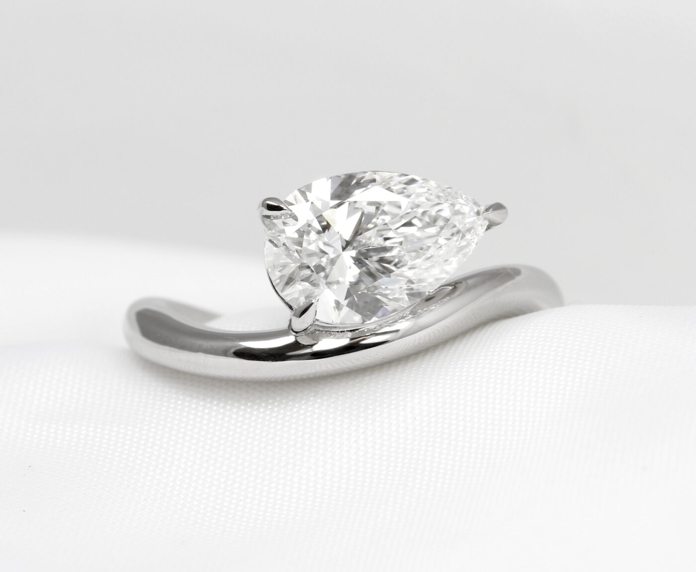 Bespoke Commission Engagement Ring with Optical Illusion Floating Pear Diamond in Platinum