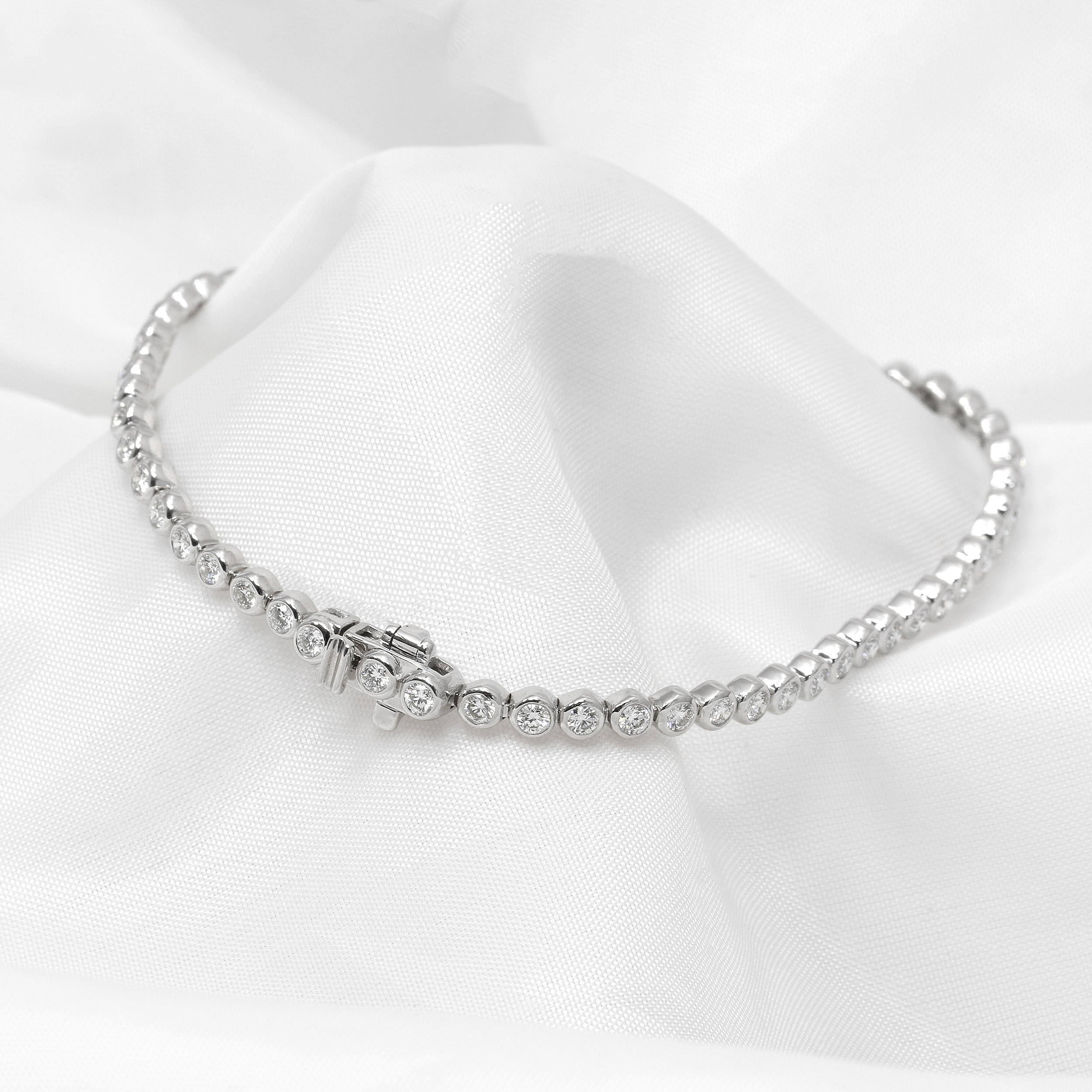 Laboratory Created Diamond Line Bracelet Rub Over Set in White Gold