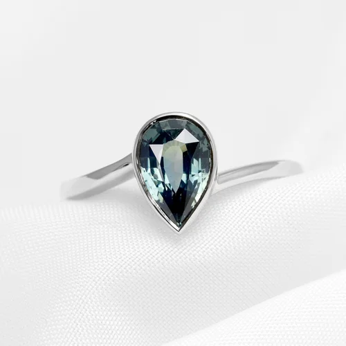 August 2023 - Pear Shape Teal Sapphire in Platinum