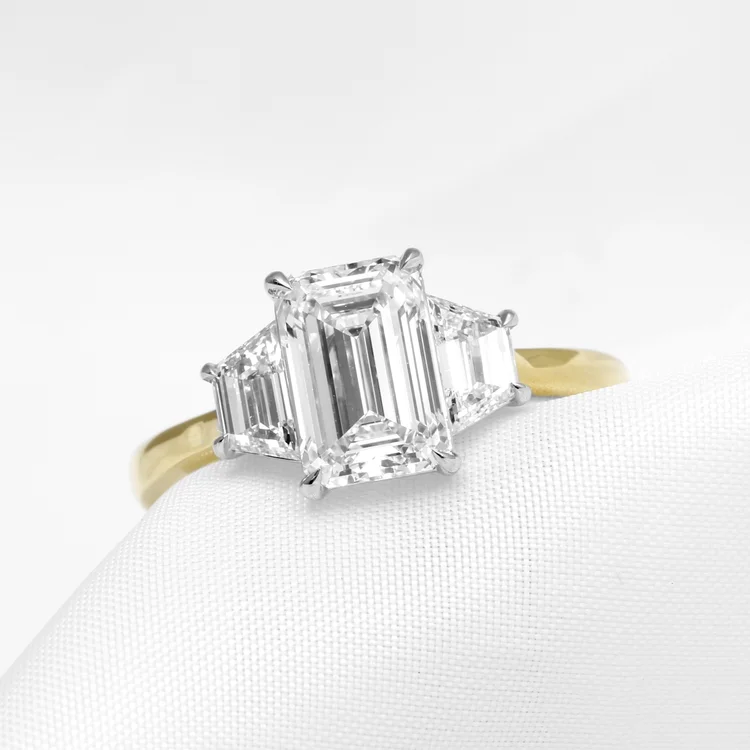 August 2024 - Emerald Cut and Trapeze Cut Diamonds in Yellow Gold and Platinum