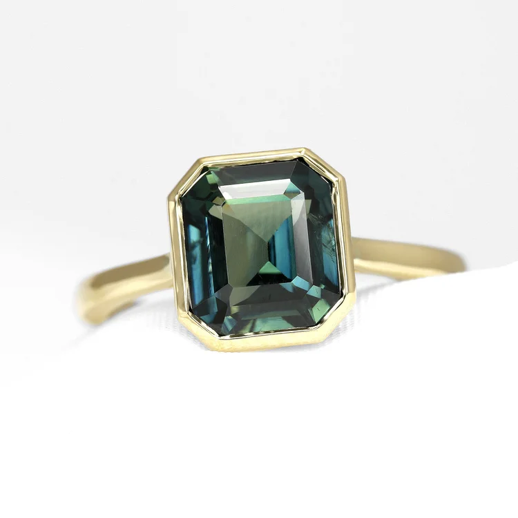 August 2024 - Teal Sapphire in Yellow Gold