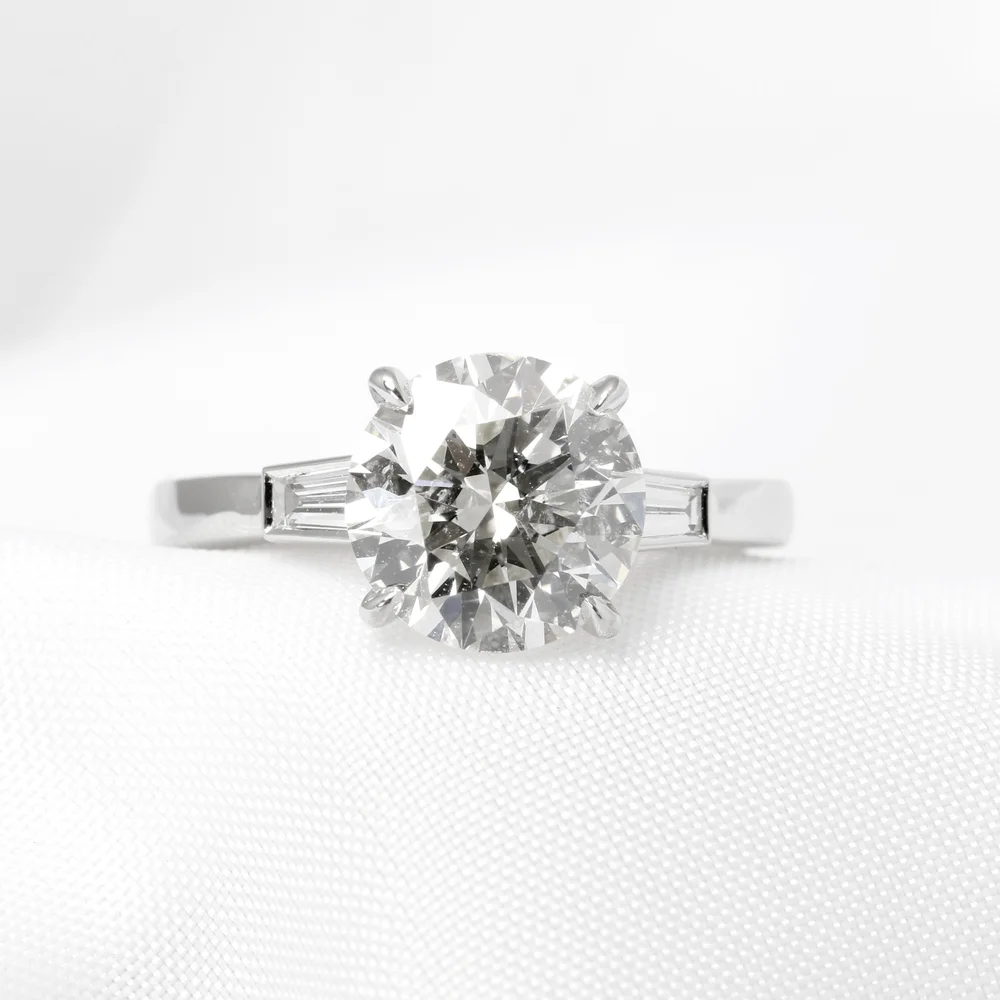 December 2022 - 2.11ct Round Diamond with Baguette Diamonds in Platinum