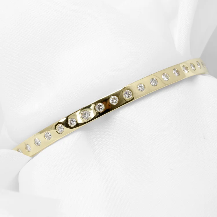 Flush Set Diamonds in a Yellow Gold Bangle