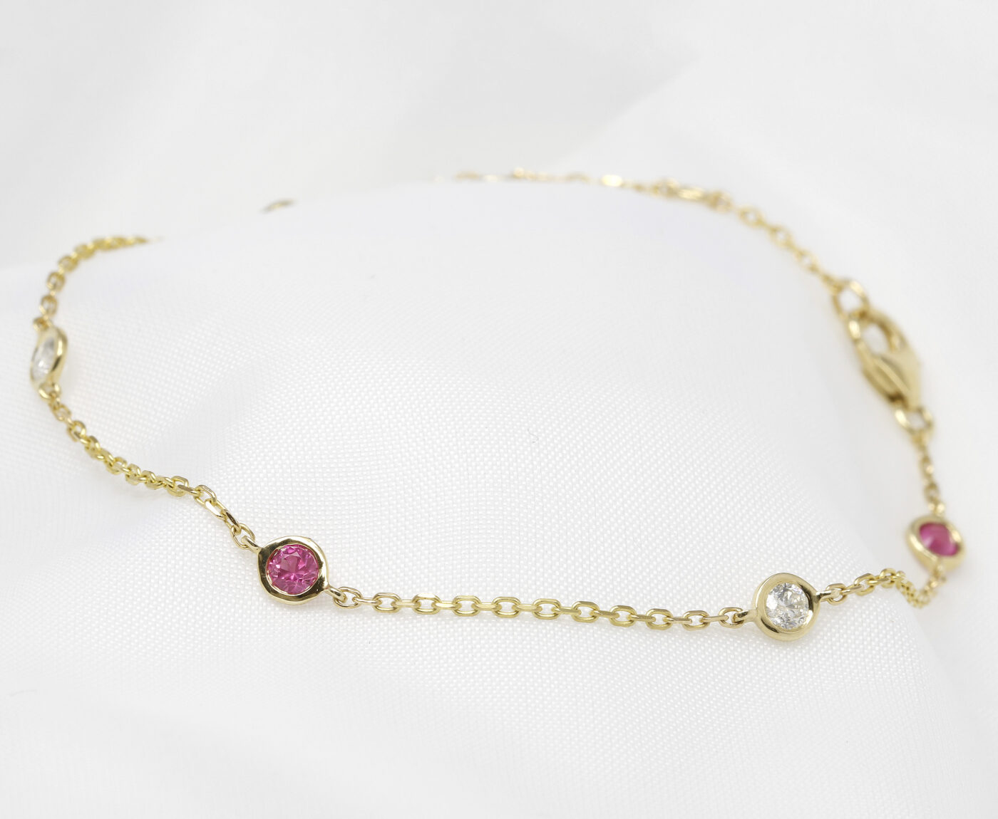 Pink Sapphire and Diamond Station Bracelet in Yellow Gold