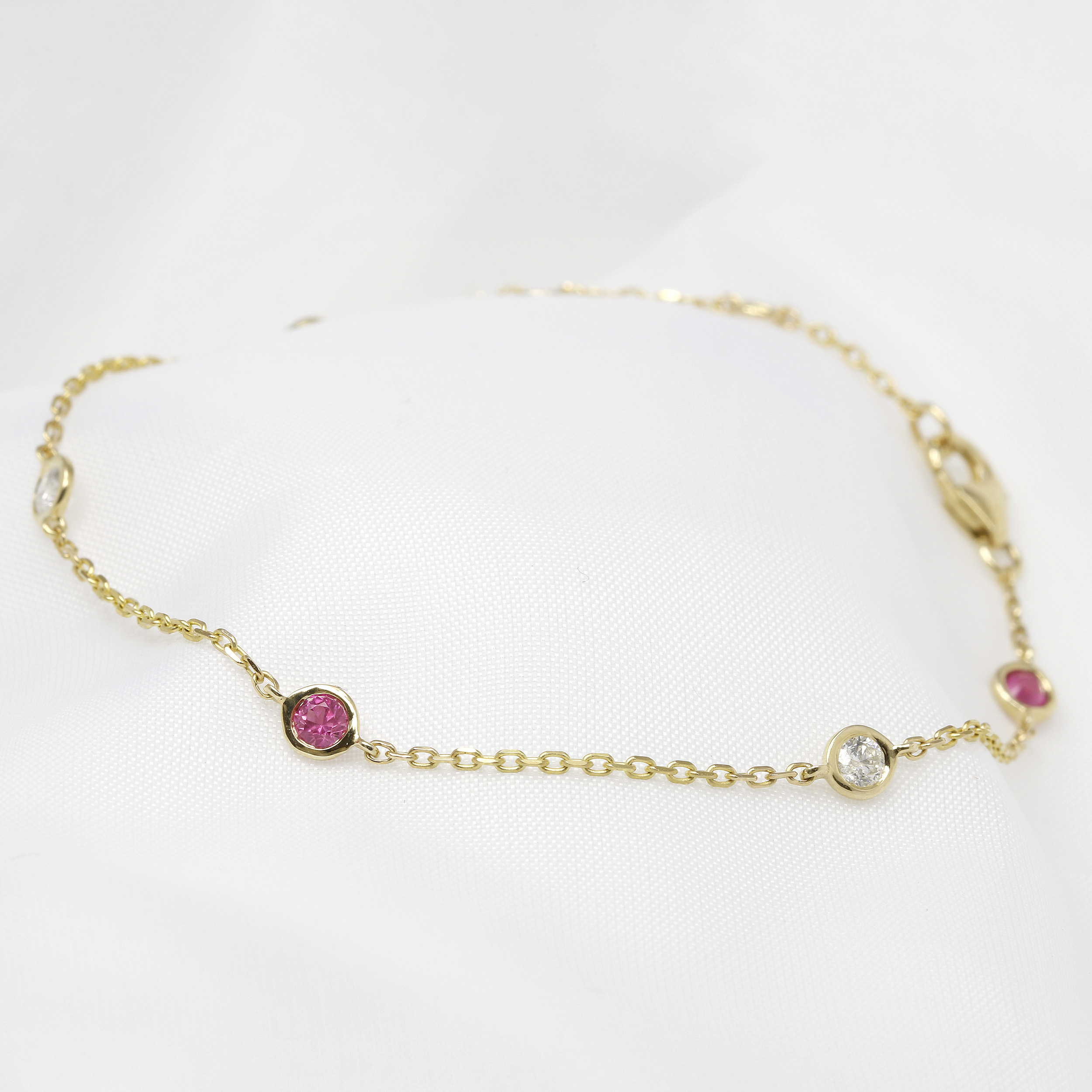 Pink Sapphire and Diamond Station Bracelet in Yellow Gold