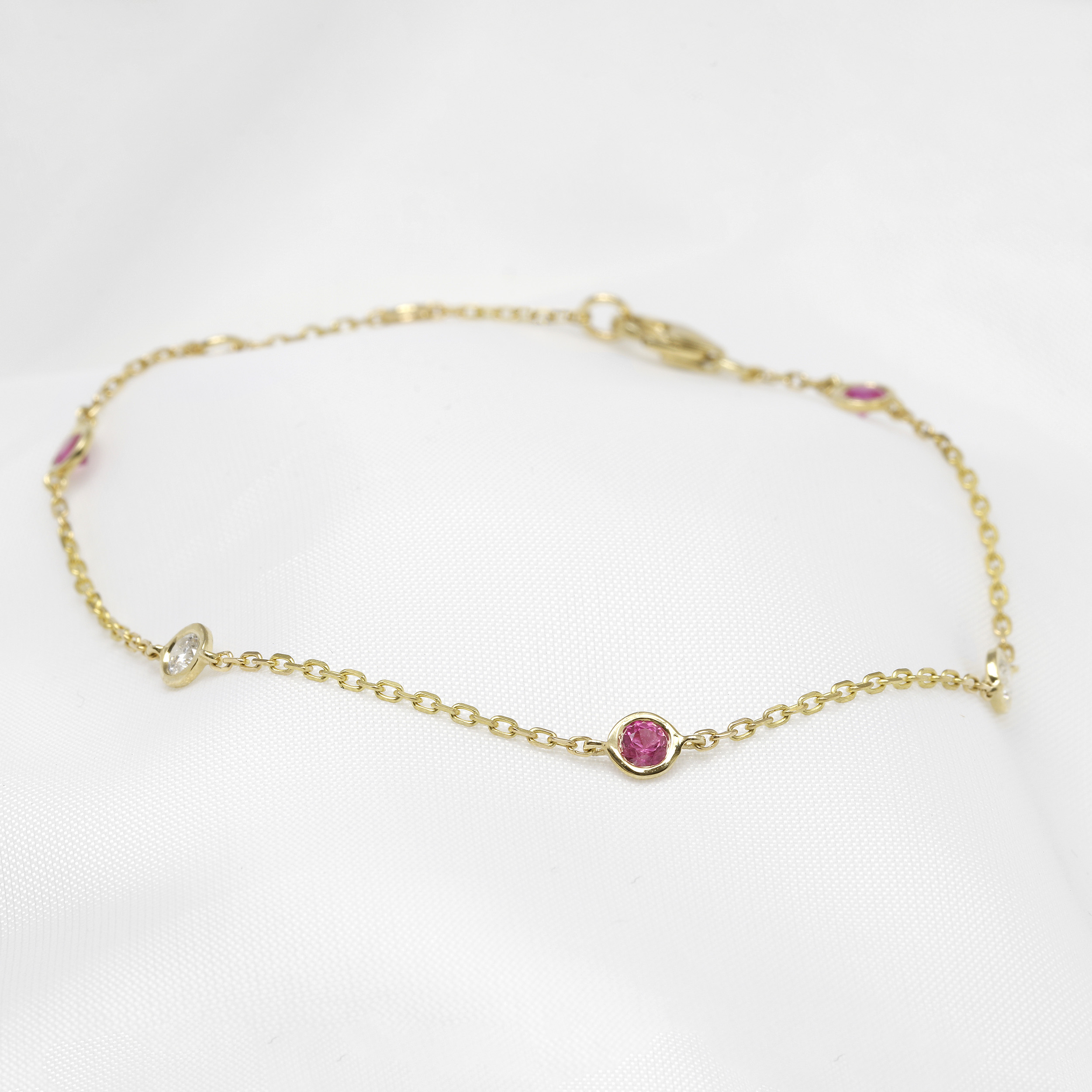 Pink Sapphire and Diamond Station Bracelet in Yellow Gold