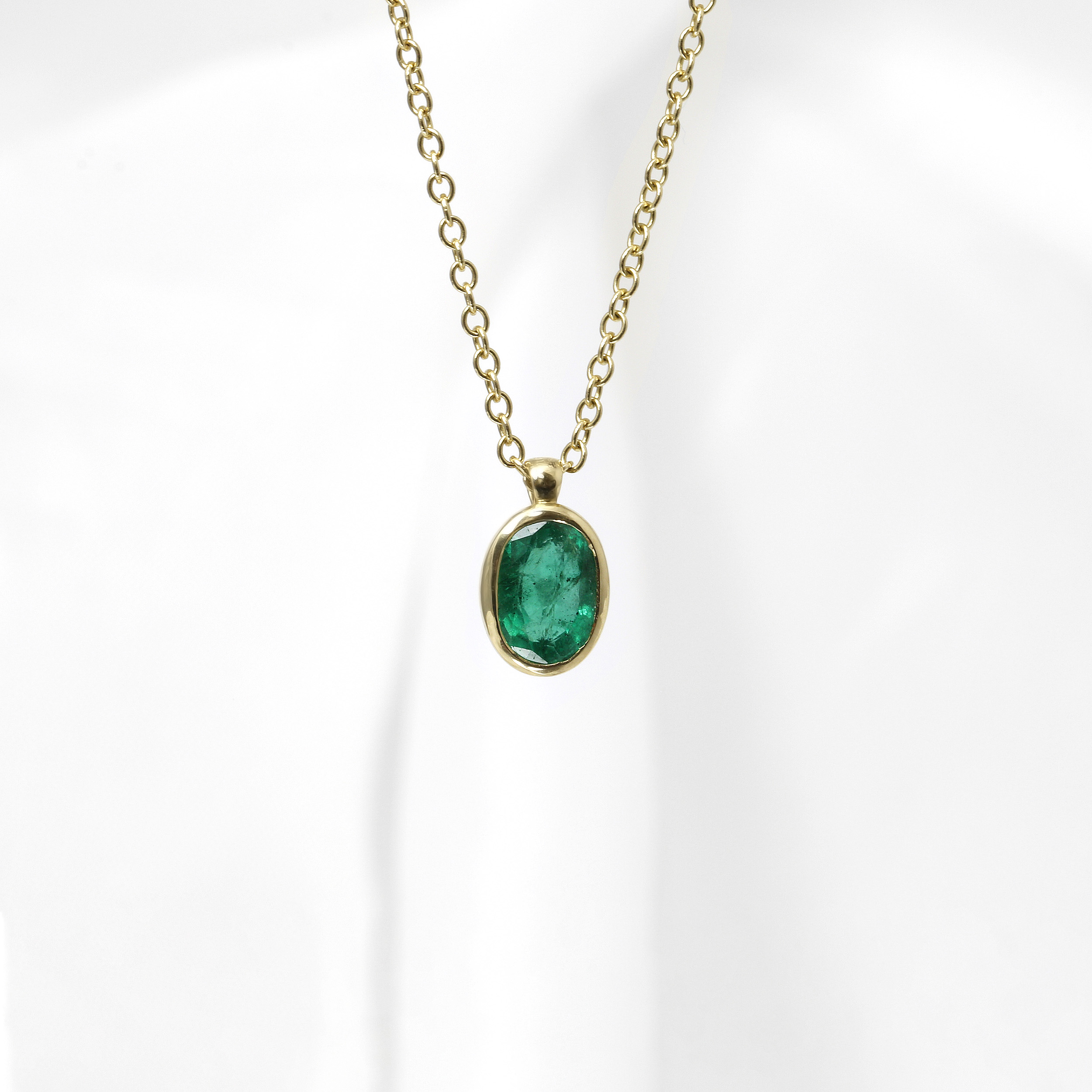 Oval Emerald Pendant in 9ct Yellow Gold
