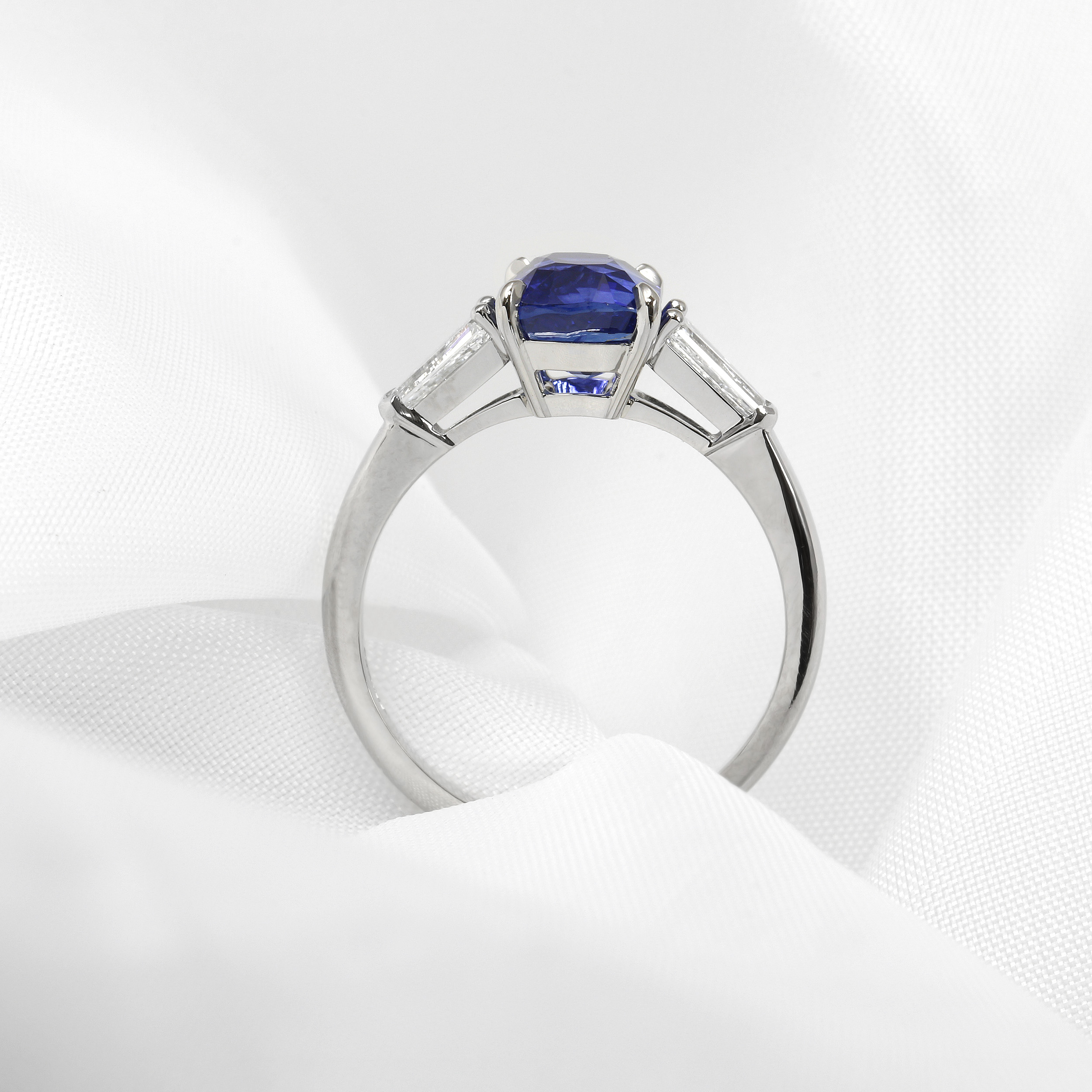 Cushion Sapphire and Diamond Three Stone Ring in Platinum