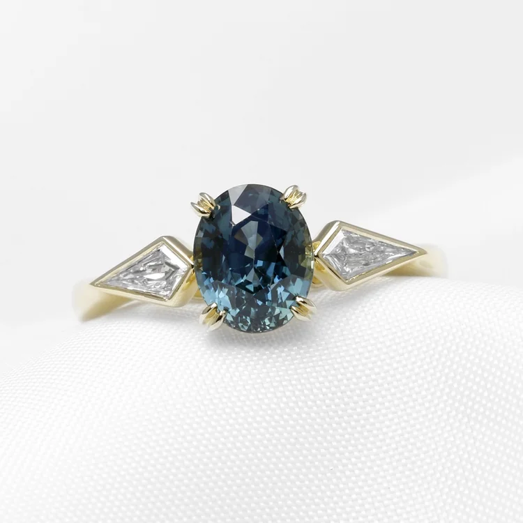 January 2025 - Teal Sapphire and Kite Shape Diamonds in Yellow Gold