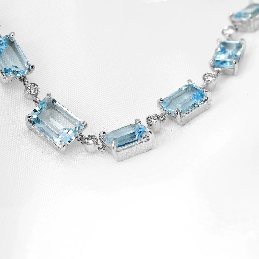 July 2022 - Blue Topaz and Diamond in White Gold