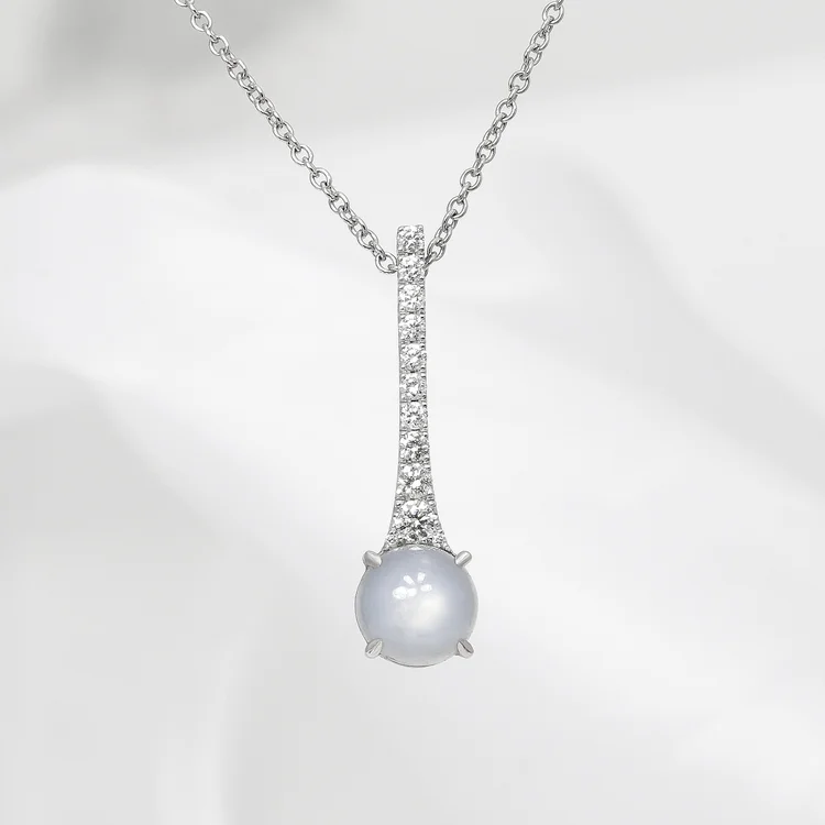 March 2024 - Star Sapphire with Round Brilliant Diamonds in White Gold.