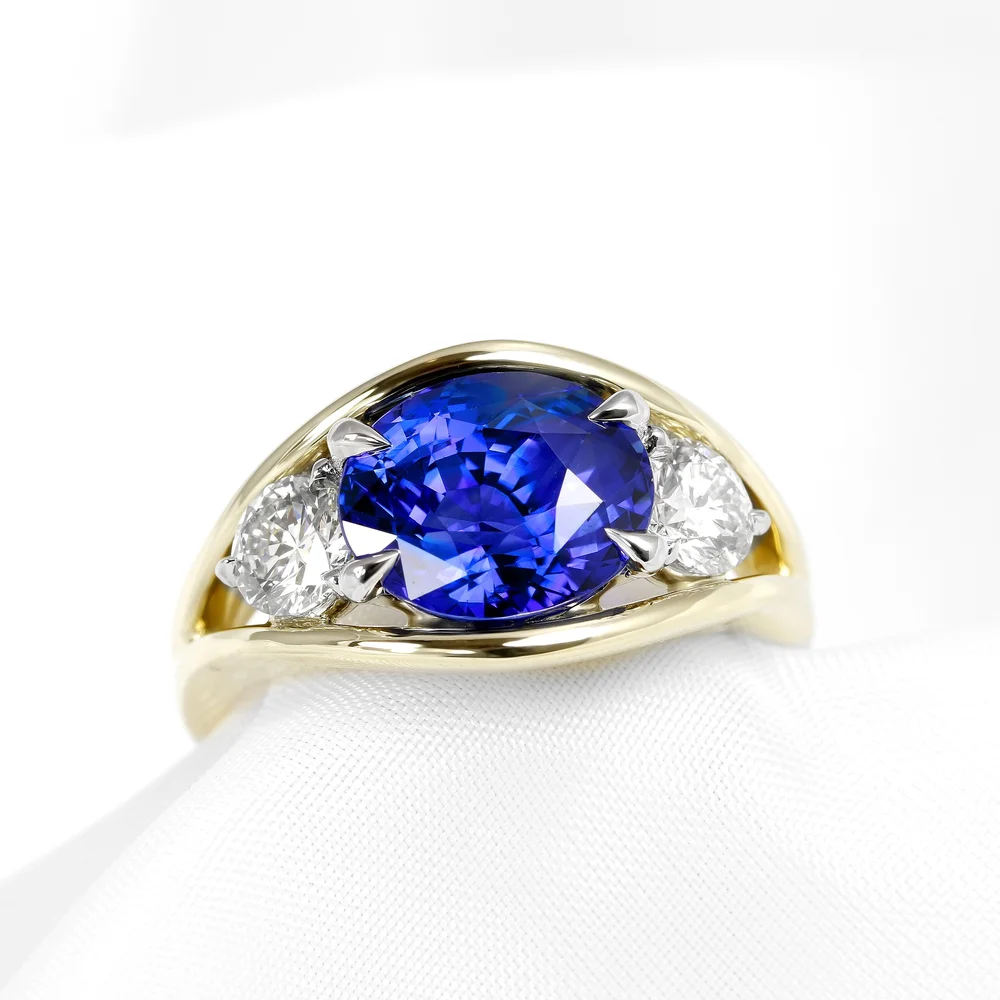 May 2023 - Oval Blue Sapphire and Round Diamonds in Platinum and Yellow Gold