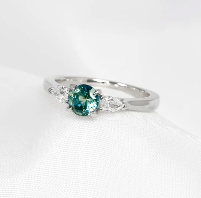 October 2022 - Teal Sapphire & Marquise Diamonds in Platinum
