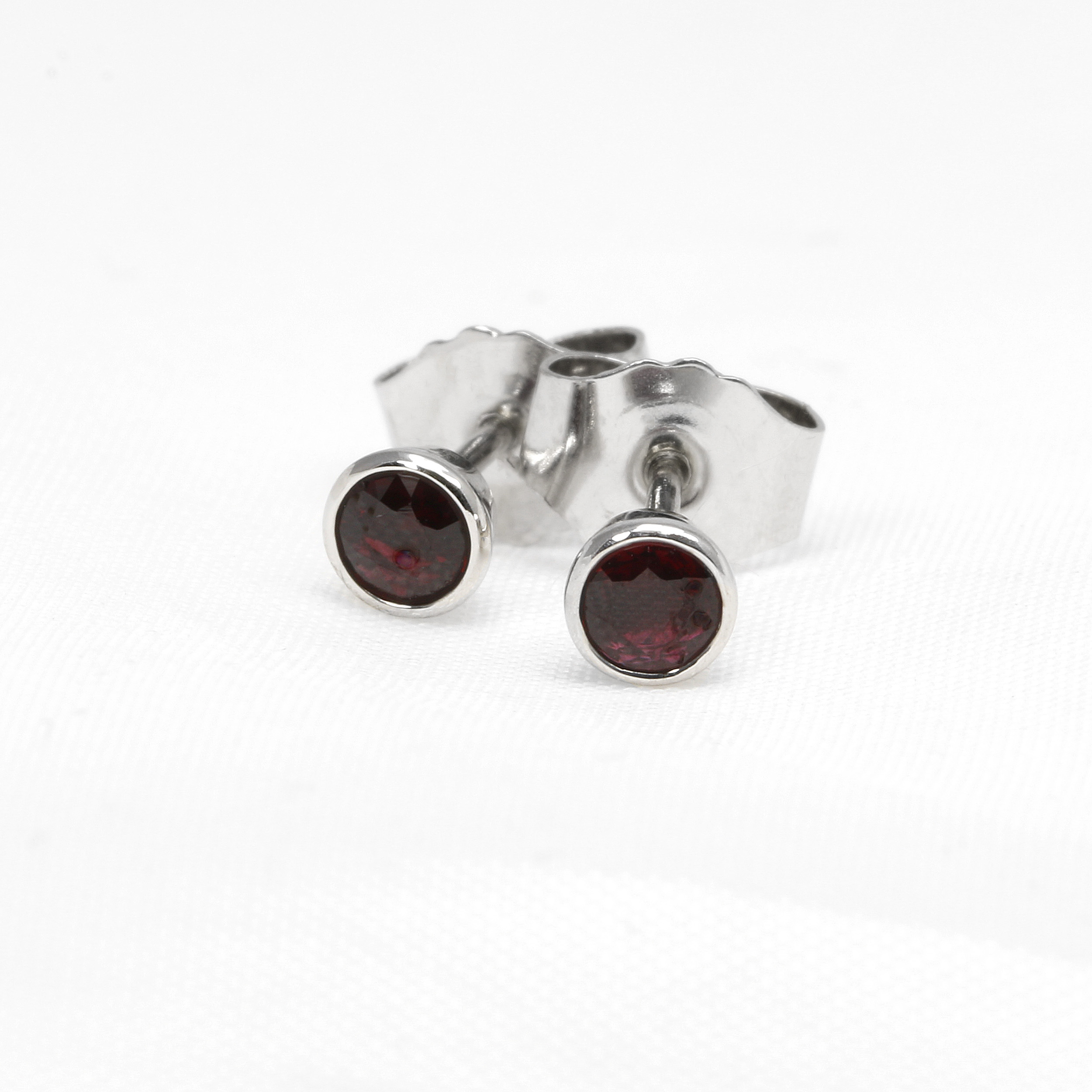 Rub Over Set Ruby Stud Earrings in 9ct White Gold
