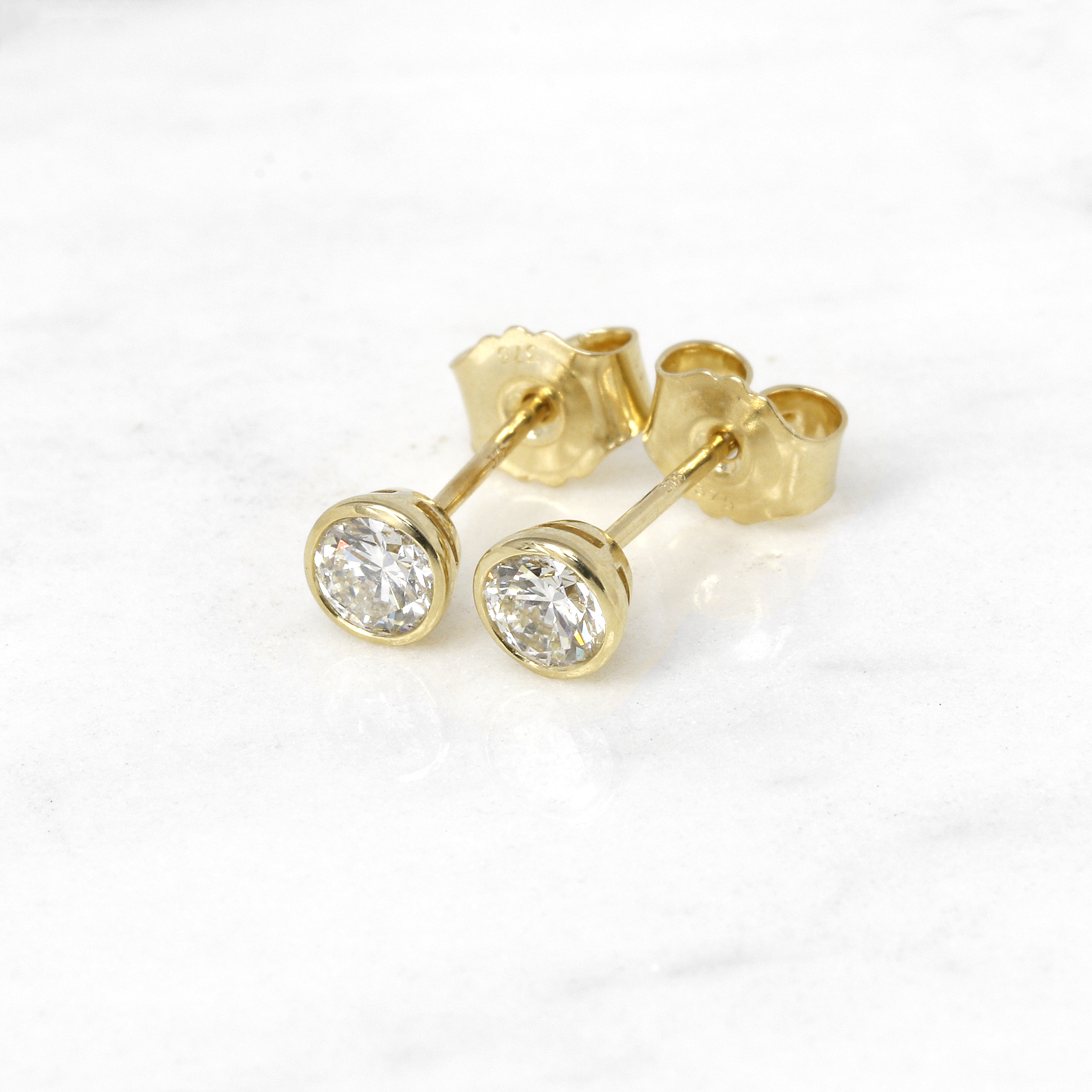 0.60ct Rub Over Diamond Solitaire Stud Earrings in Yellow Gold