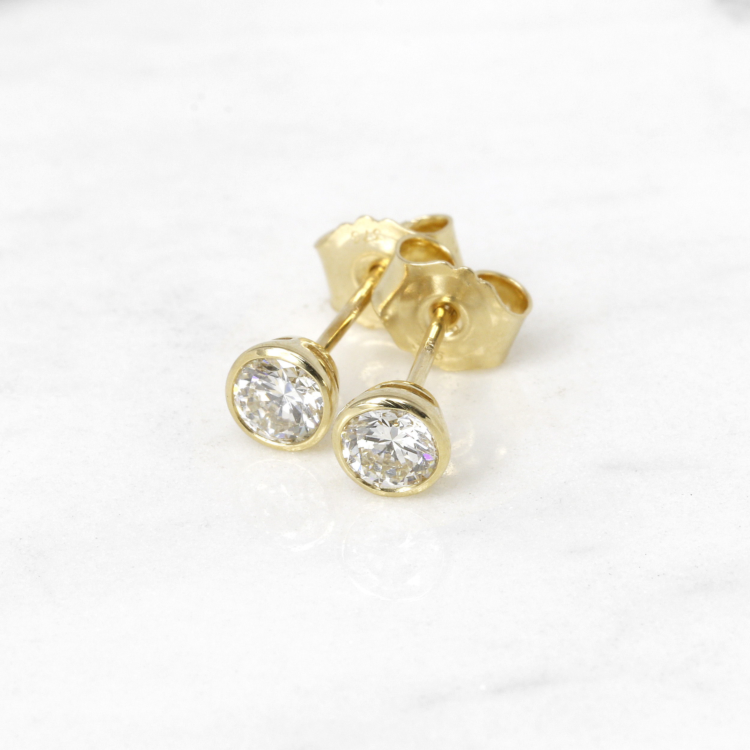 0.60ct Rub Over Diamond Solitaire Stud Earrings in Yellow Gold