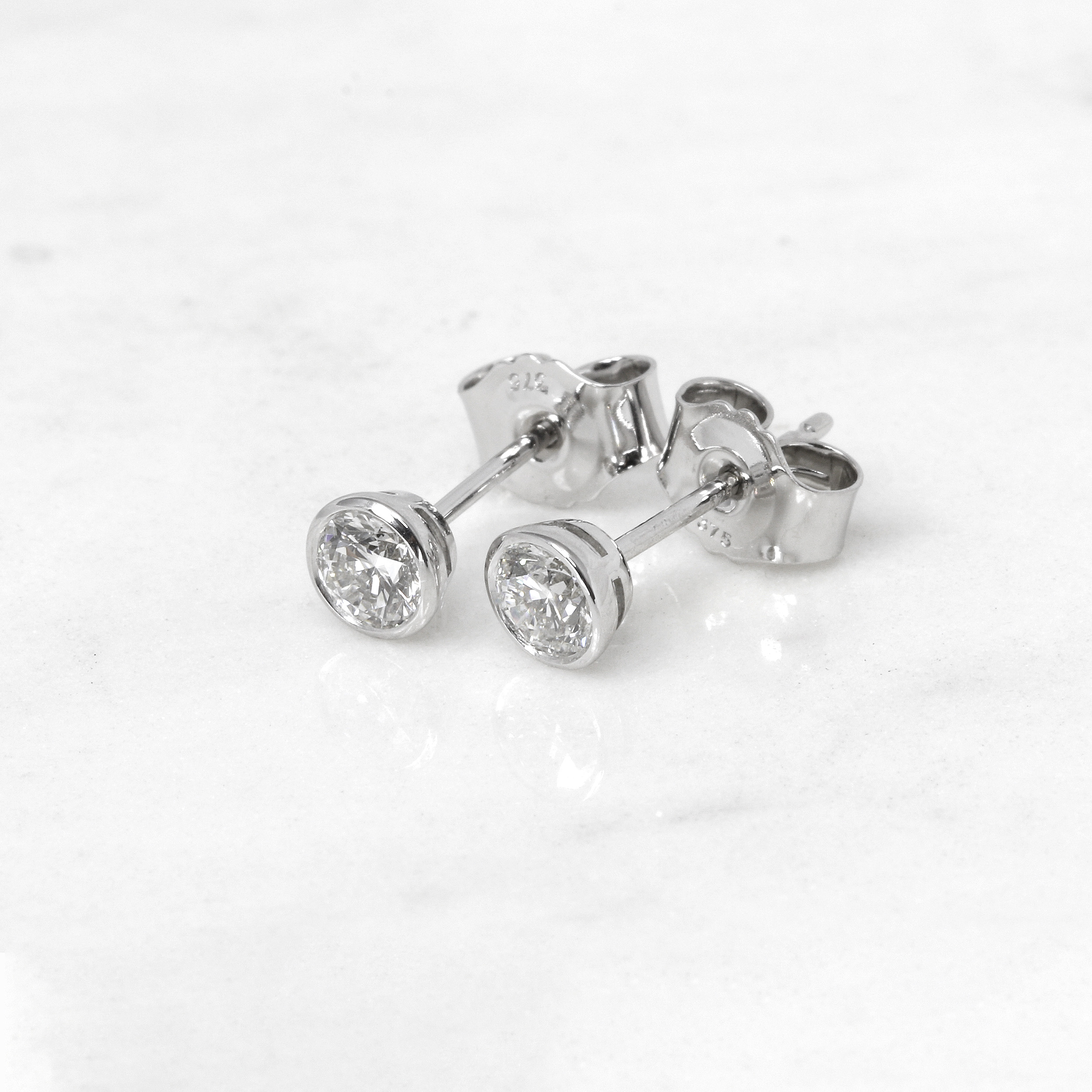 0.60ct Rub Over Diamond Solitaire Stud Earrings