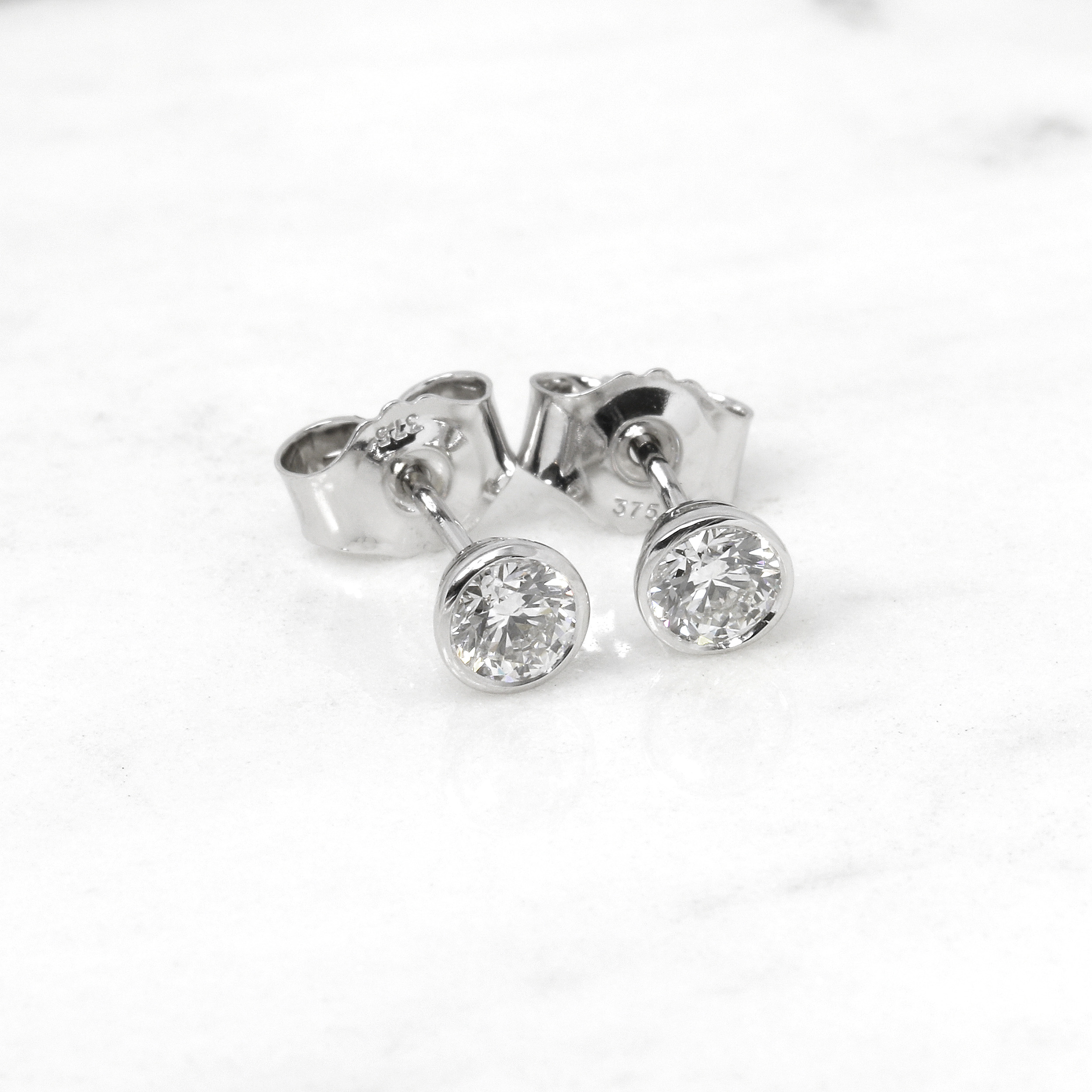 0.60ct Rub Over Diamond Solitaire Stud Earrings