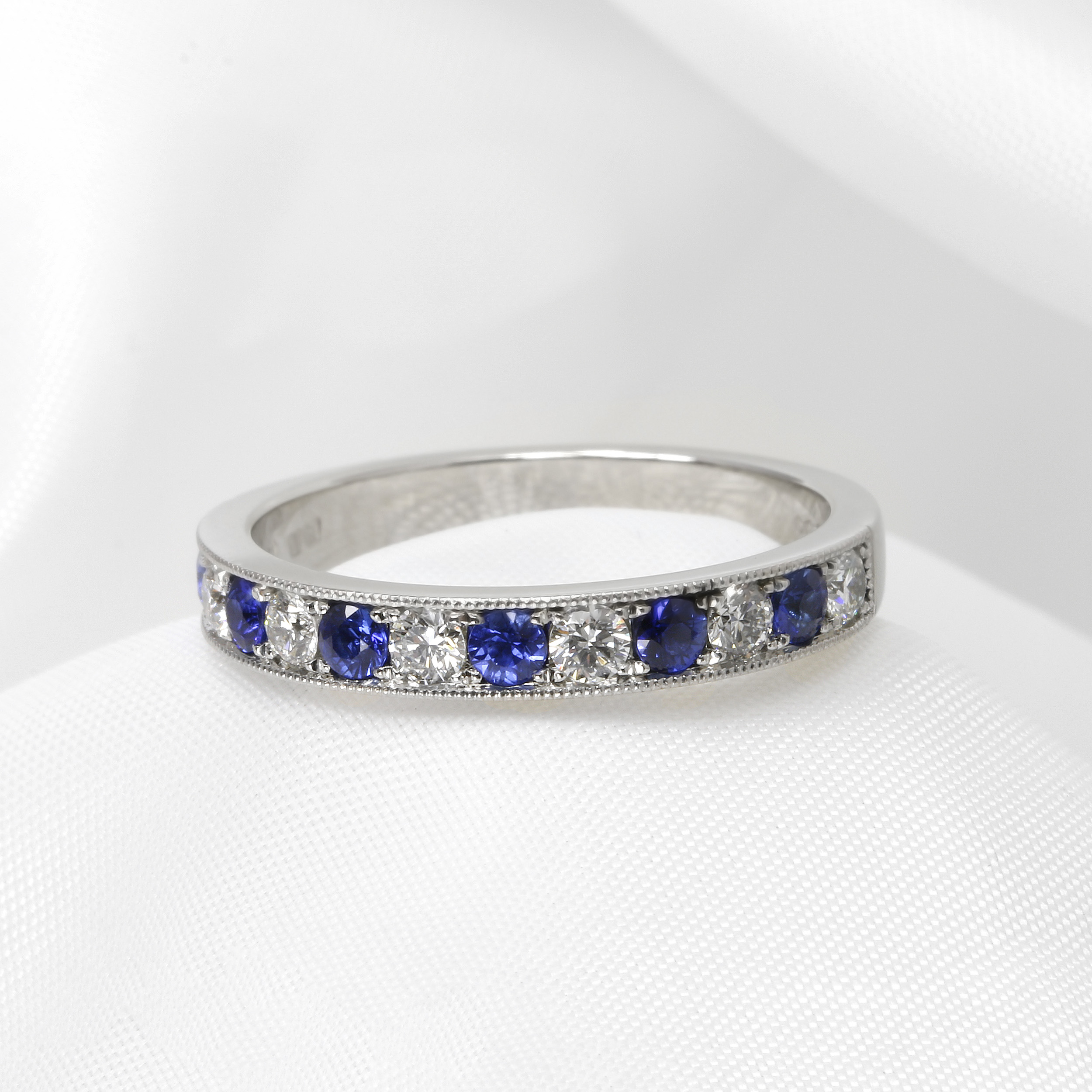 Grain Set Sapphire and Diamond Eternity Ring in Platinum