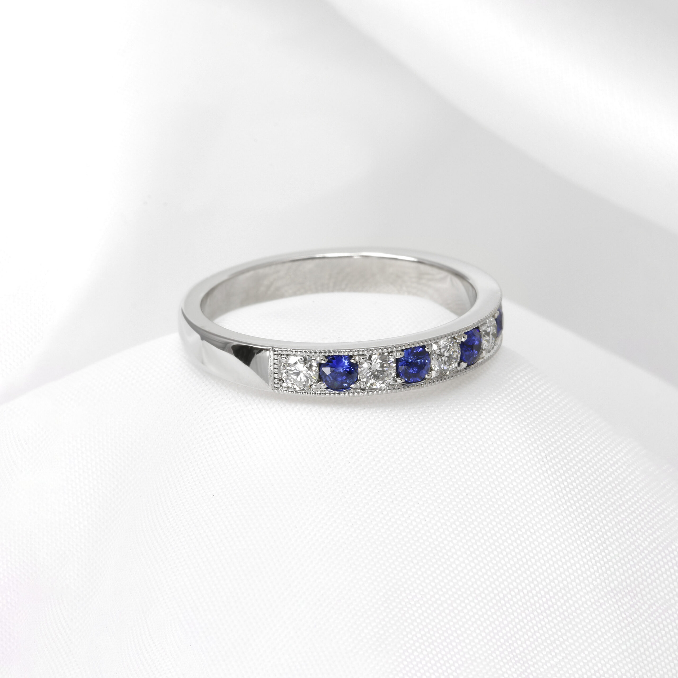 Grain Set Sapphire and Diamond Eternity Ring in Platinum