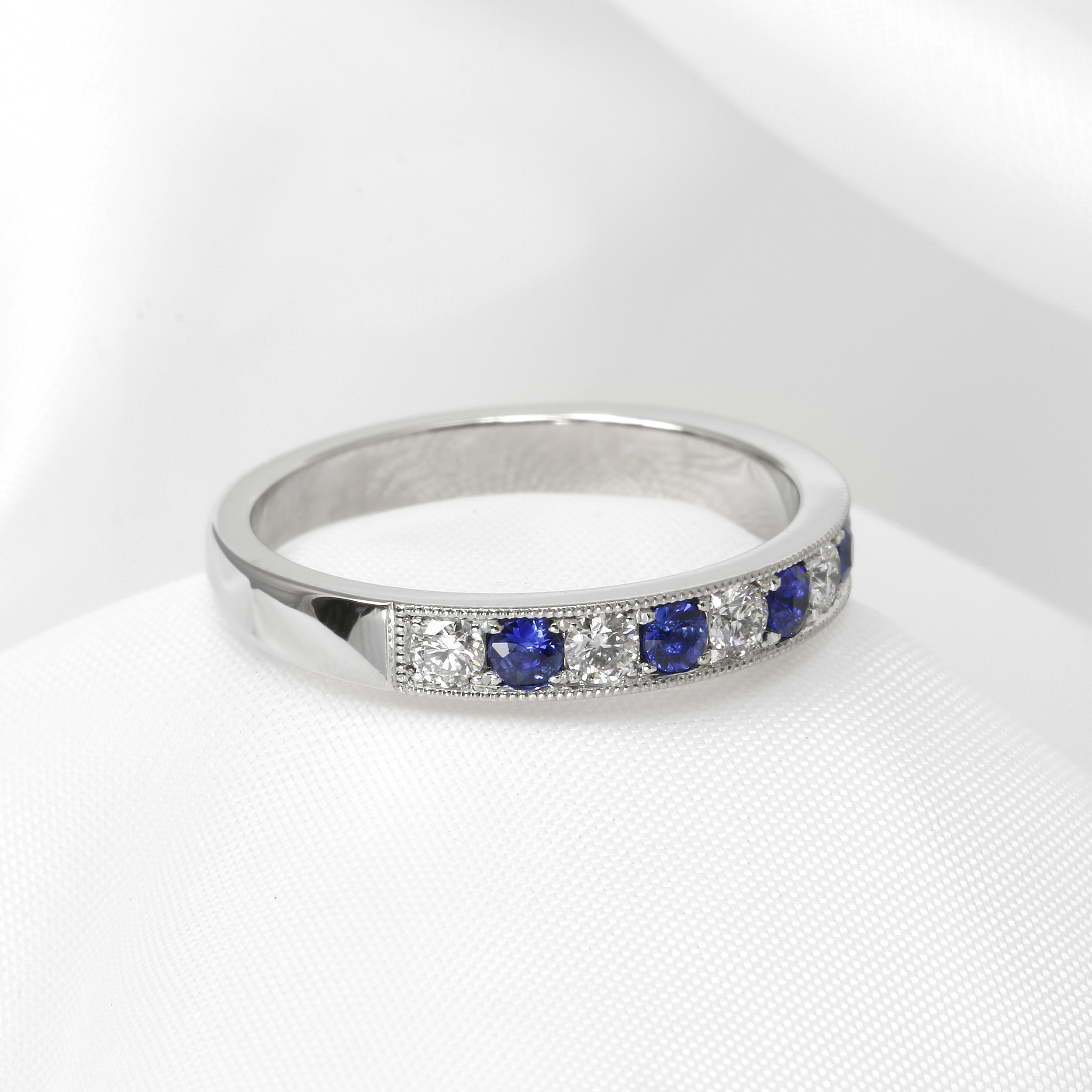 Grain Set Sapphire and Diamond Eternity Ring in Platinum