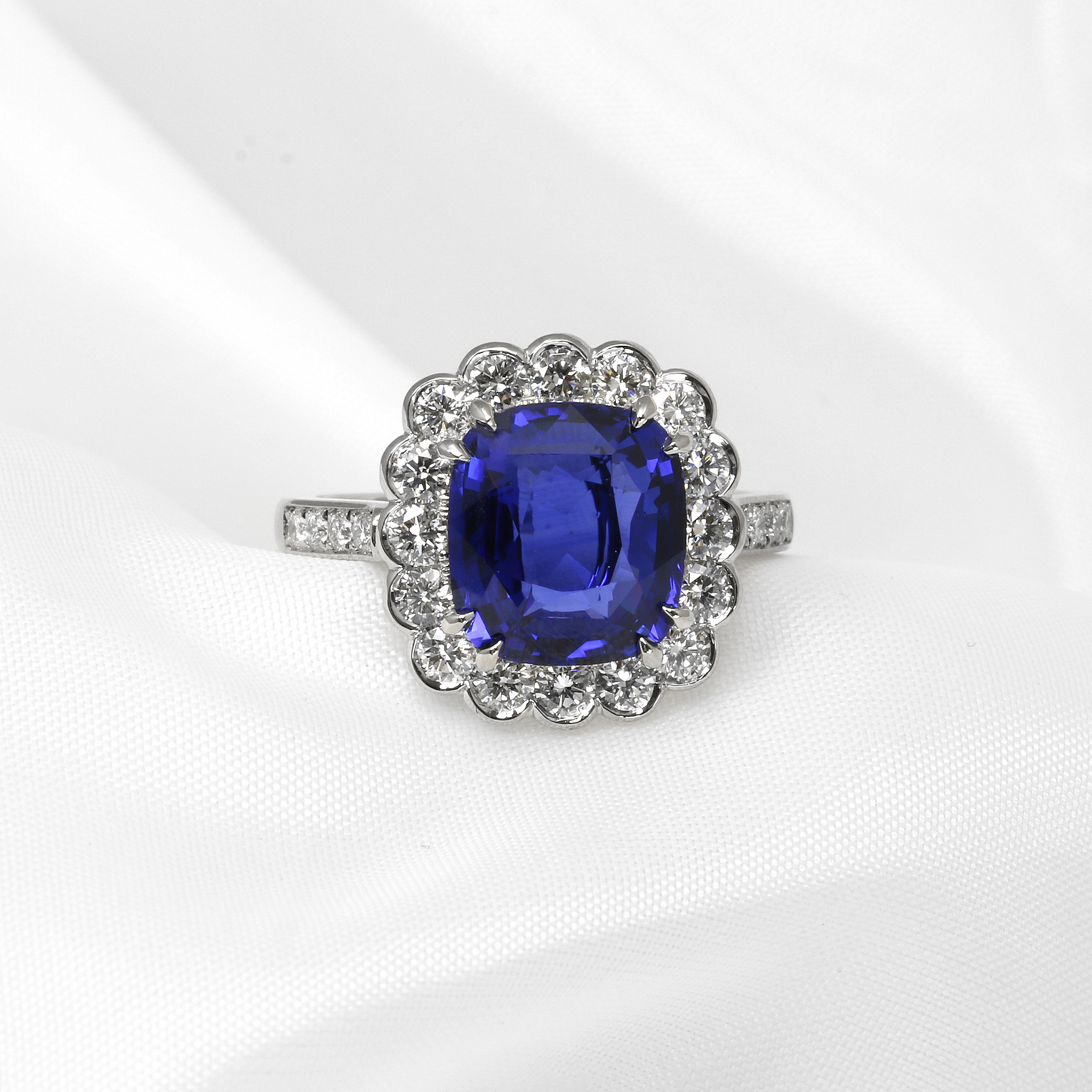 Cushion Cut Sapphire and Diamond Halo Cluster Ring in Platinum