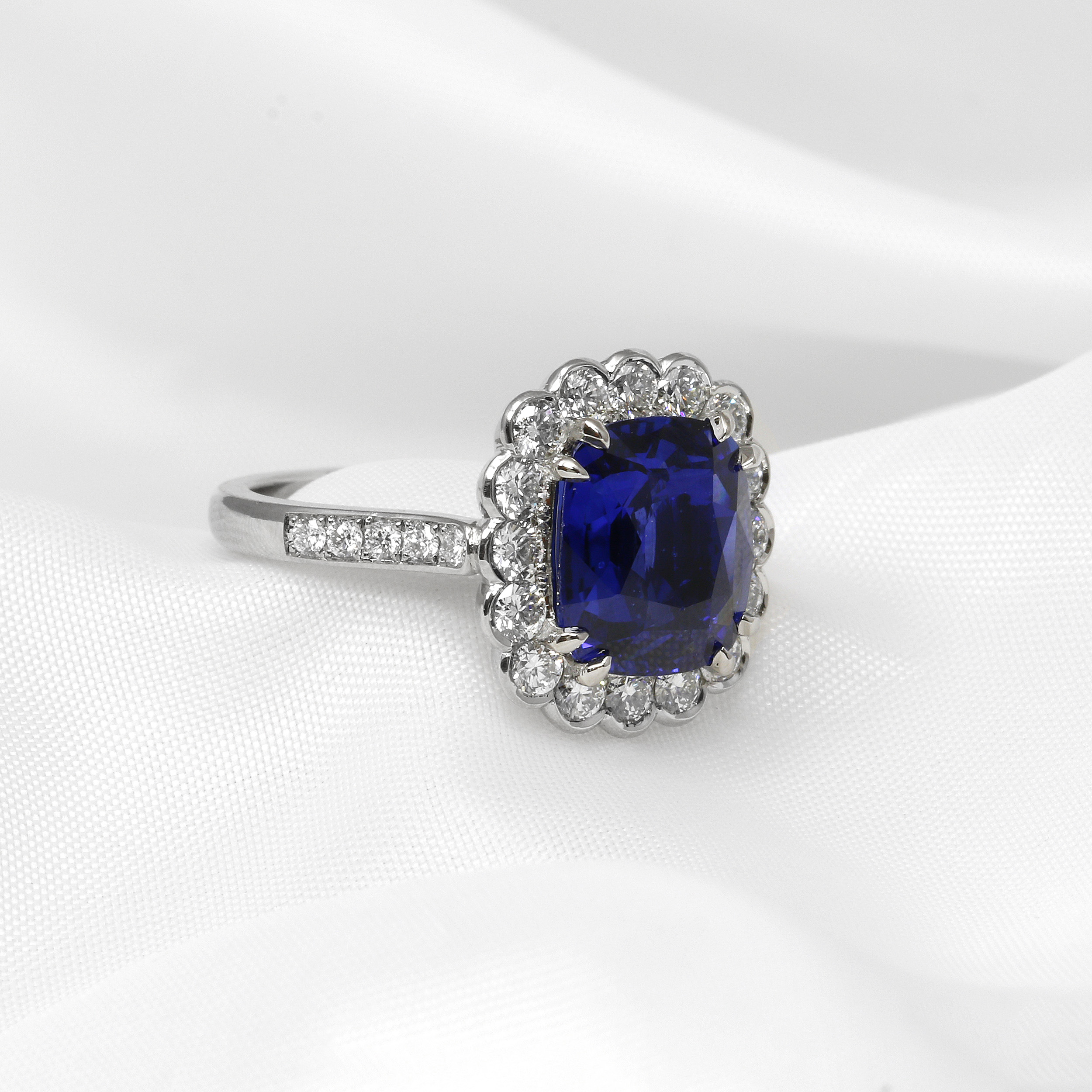 Cushion Cut Sapphire and Diamond Halo Cluster in Platinum