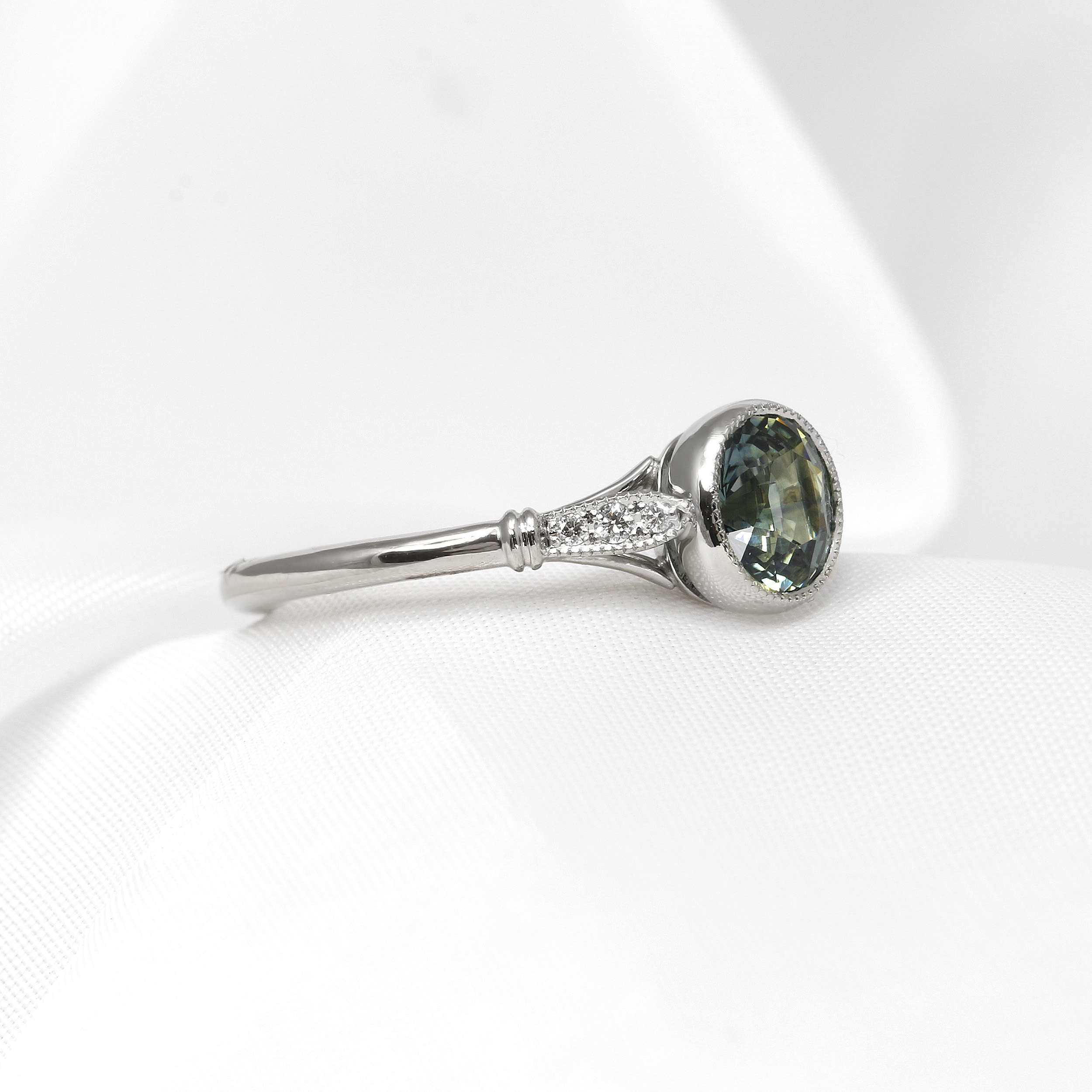 Teal Sapphire Solitaire Ring with Diamond Set Shoulders in Platinum
