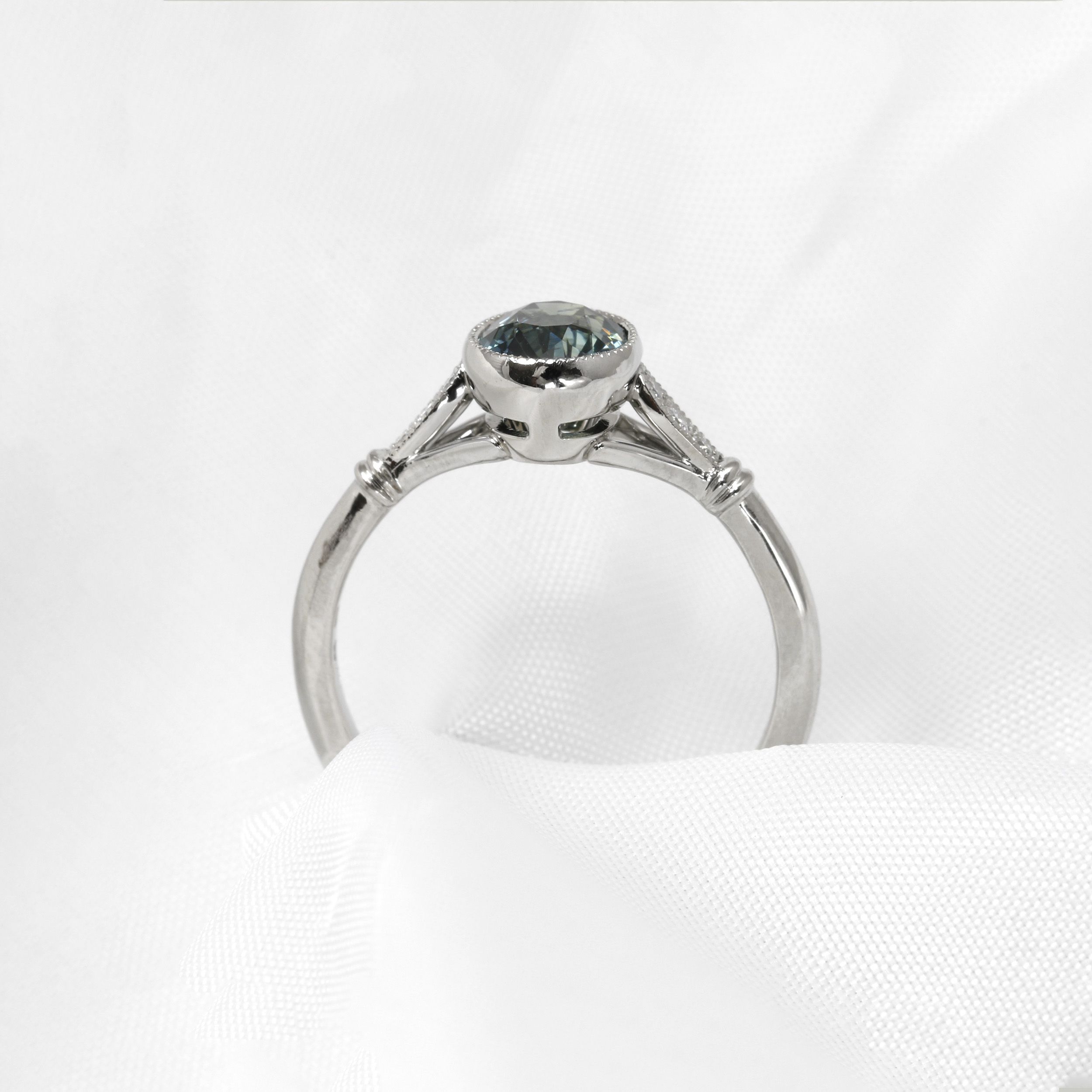 Teal Sapphire Solitaire Ring with Diamond Set Shoulders in Platinum
