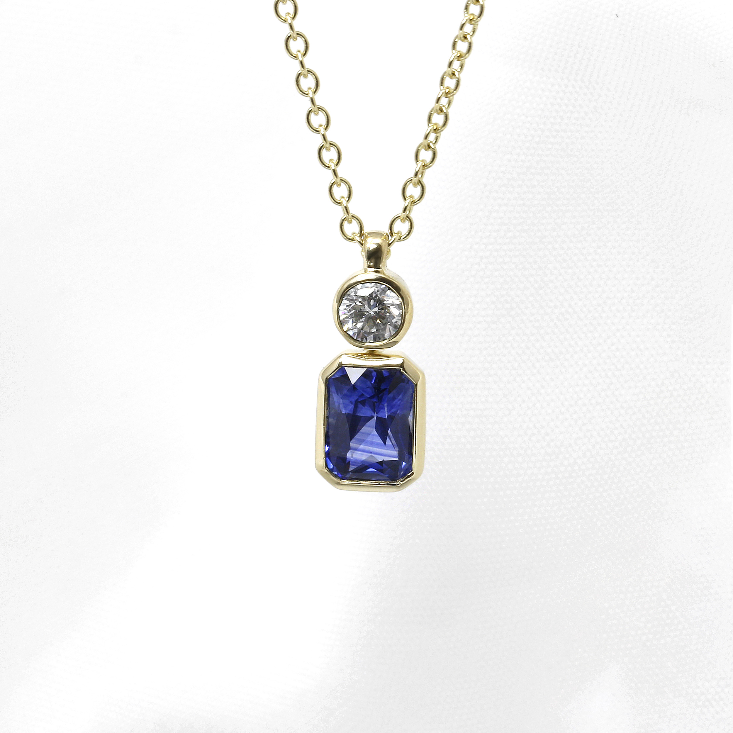 Blue Sapphire and Diamond Pendant in 9ct Yellow Gold