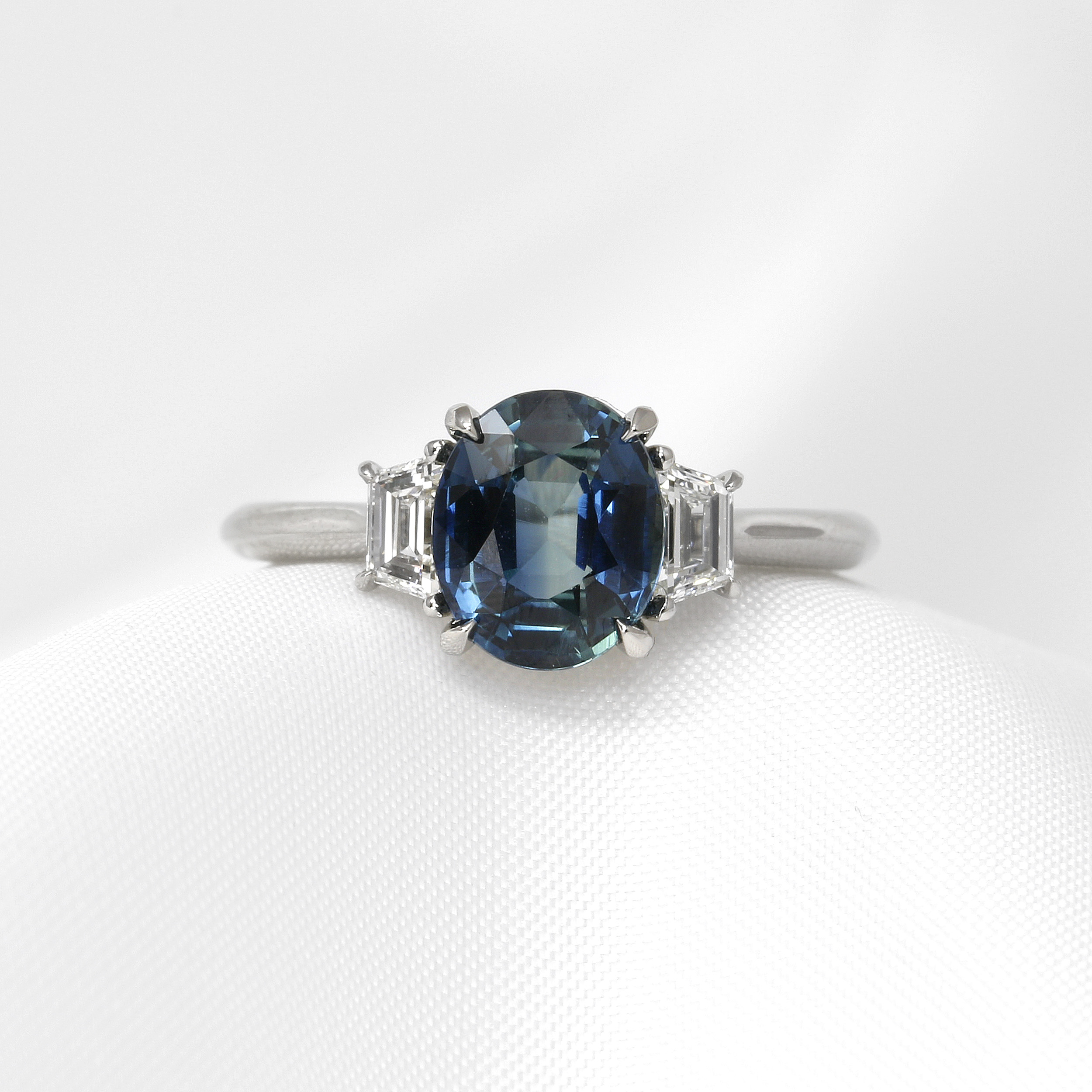 Oval Teal Sapphire and Diamond Three Stone Ring in Platinum