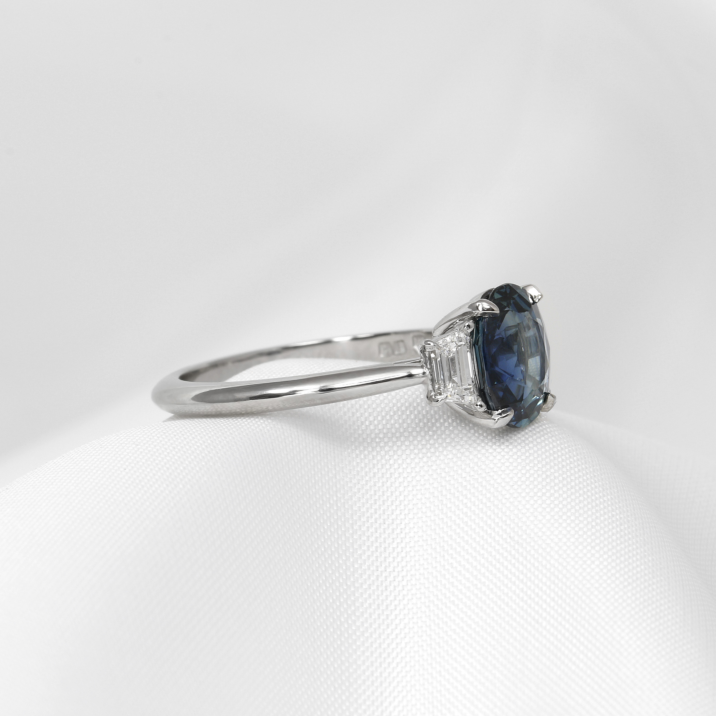 Oval Teal Sapphire and Diamond Three Stone Ring in Platinum